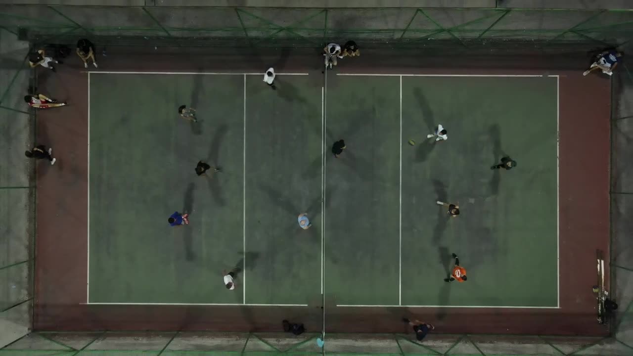 Aerial view of a volleyball match on an outdoor court